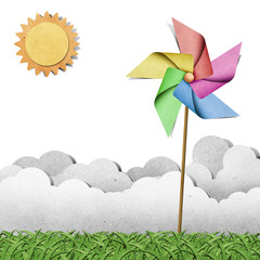 Wall Mural - windmill on grass recycled papercraft background