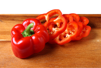 Image of sweet red pepper sliced on hardboard