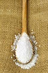 Coarse sea salt on a wooden spoon