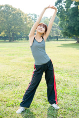 Wall Mural - beautiful asian woman exercising in the park