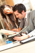 © goodluz - Business team checking planning on agenda