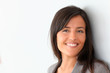 © goodluz - Beautiful businesswoman standing on grey background
