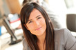 © goodluz - Portrait of beautiful businesswoman at work