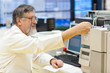 © lightpoet - senior male researcher carrying out scientific research in a lab