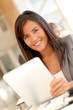 © goodluz - Beautiful businesswoman using electronic tablet