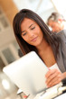 © goodluz - Beautiful businesswoman using electronic tablet