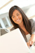 © goodluz - Portrait of beautiful businesswoman at work
