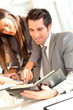 © goodluz - Business team checking planning on agenda