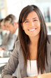 © goodluz - Portrait of beautiful businesswoman at work