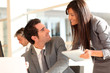 © goodluz - Business team using electronic tablet at work