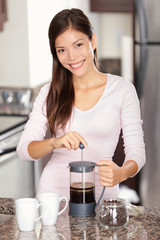 Sticker - Woman making coffee in kitchen