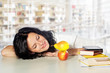 © Ingo Bartussek - pretty female student looking at an apple and a pear