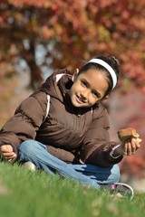 Wall Mural - Girl Eating Sandwich at the Park