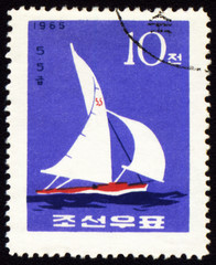 Canvas Print - Yacht in a sea on post stamp