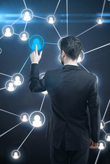 Poster - Businessman pressing a touchscreen Social Network button