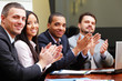 © Drobot Dean - Multi ethnic business group greets you with clapping
