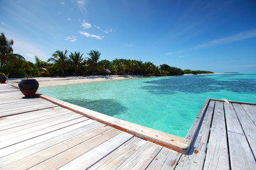 Wall Mural - resort maldivian houses in blue sea