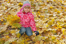 Little Girl With Yellow Leaves