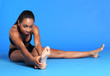 Young black woman hamstring stretch exercise