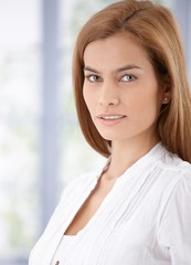 Wall Mural - Portrait of beautiful young woman smiling