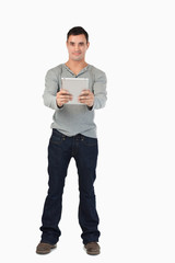 Poster - Young male holding his tablet