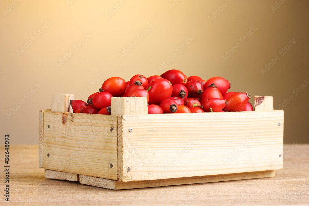ripe briar in wooden box on wooden table on brown background