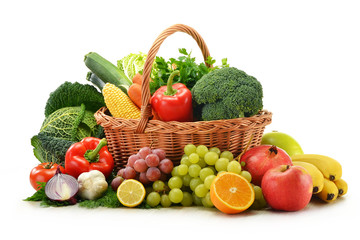 Fototapete - Composition with vegetables and fruits in wicker basket isolated