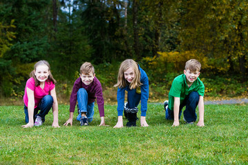 Wall Mural - Group of kids at the starting line of a race