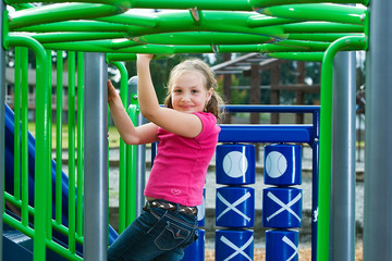 Wall Mural - Child playing at school playground