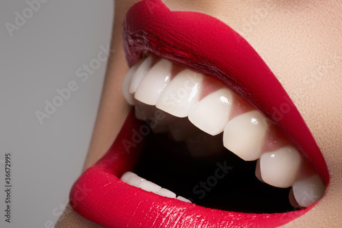 Naklejka ścienna Close-up happy female smile with healthy white teeth