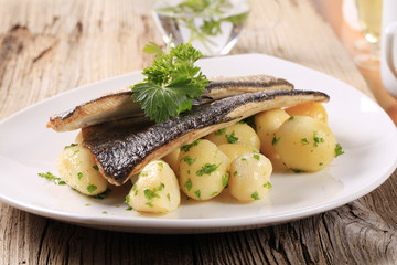 Wall Mural - Pan fried trout fillets with potatoes