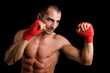 © cristovao31 - Young Boxer fighter over black background