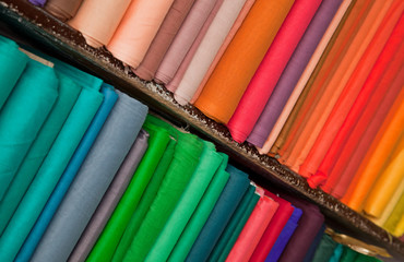 Shelves of colorful textiles and fabrics