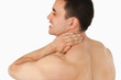 © WavebreakmediaMicro - Young man suffering from neck pain