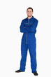 © WavebreakmediaMicro - Smiling young mechanic in boiler suit with arms folded