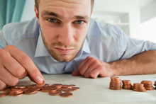 Desperate Businessman Counting His Change