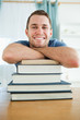 © WavebreakmediaMicro - Happy student with his books