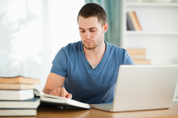Poster - Student using his laptop for his homework
