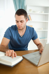 Poster - Student researching with his laptop