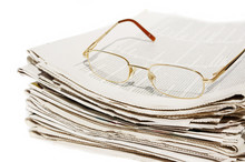 Big Pack Of Newspapers And Glasses