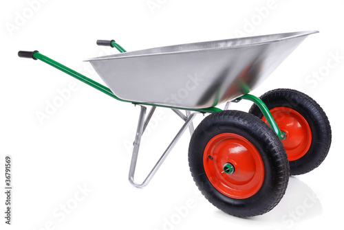 Fotografía wheelbarrow isolated on a white background.