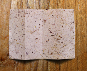 paper on wood background