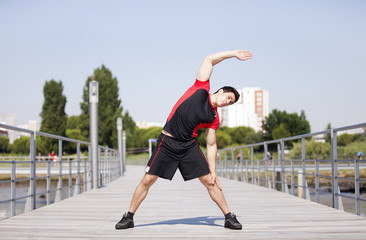 Wall Mural - Athlete warming and stretching