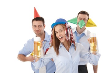 Young people having party in office laughing