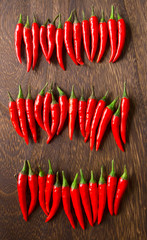 Poster - close up of red chili padi on wooden table