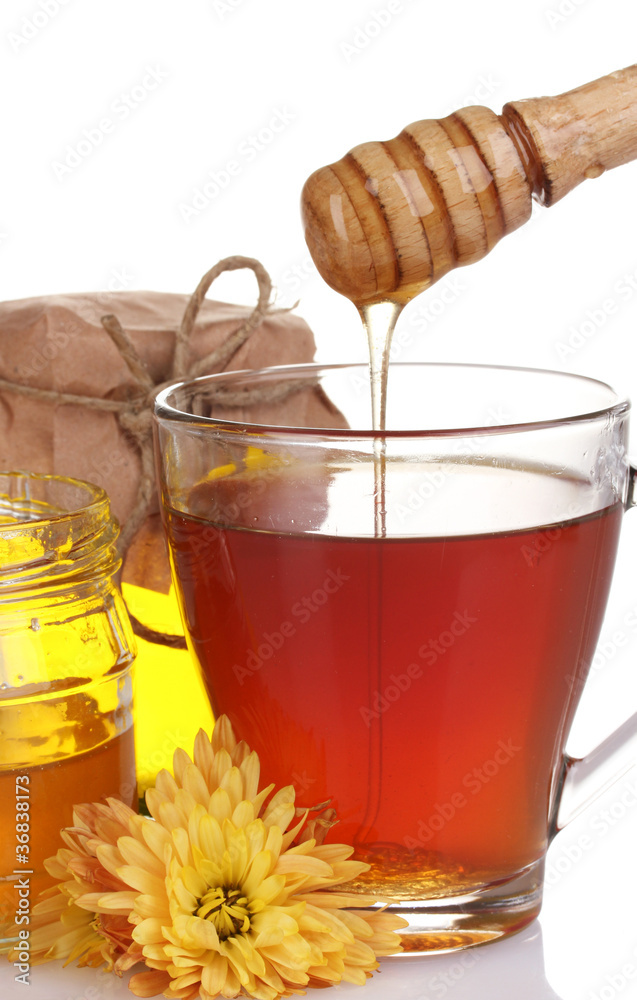 honey and cup of tea isolated on white
