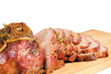 Roast pork on a wooden board