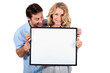 © auremar - Couple holding white board