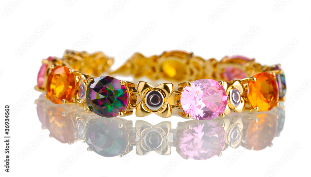 Beautiful golden bracelet with precious stones isolated on white