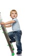 © Nejron Photo - Cute little boy climbing on a ladder.